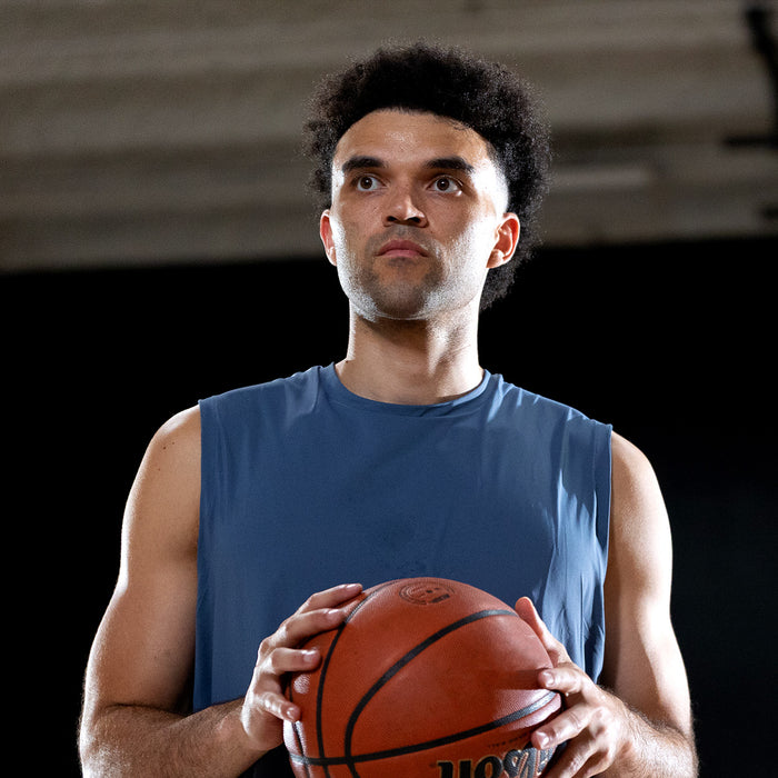 Elijah Bryant holding a basketball