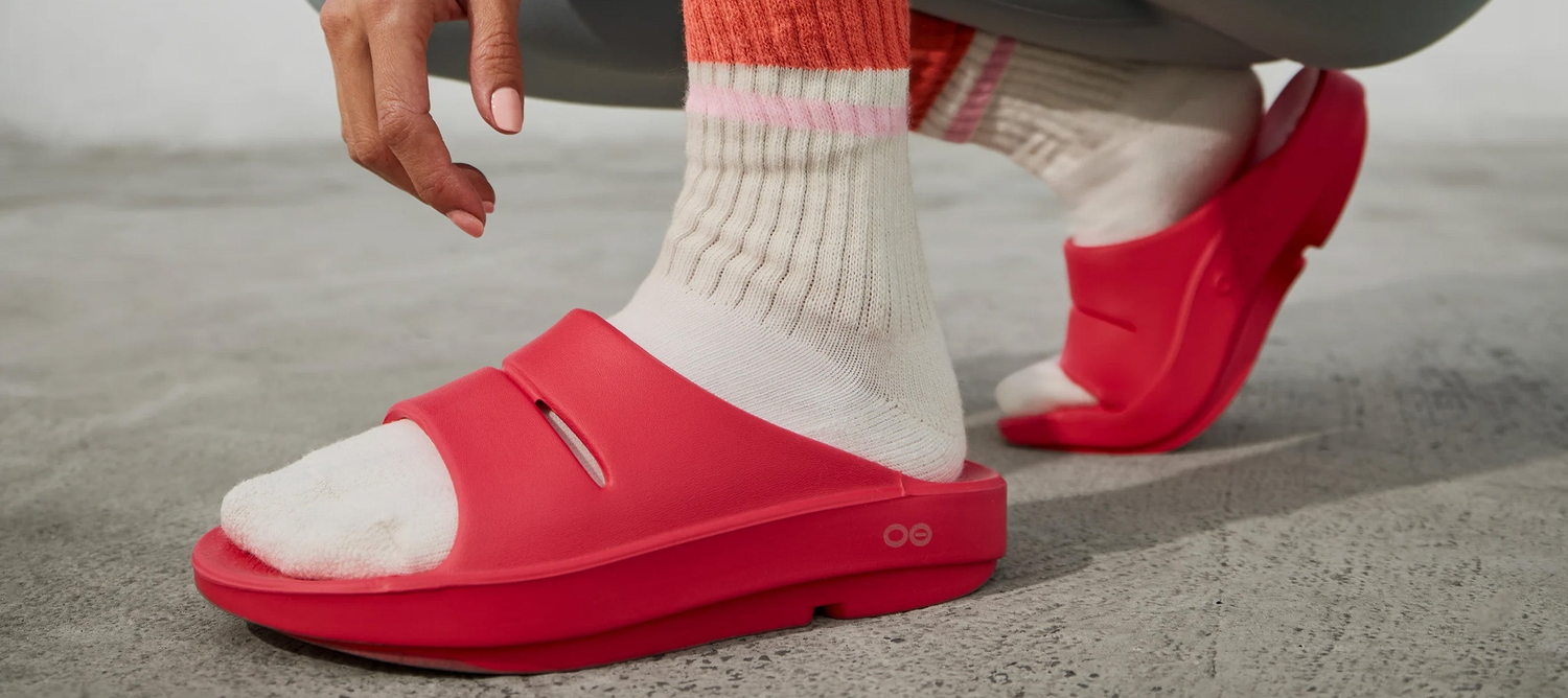model on hardwood floor wearing oomega oolala neon berry
