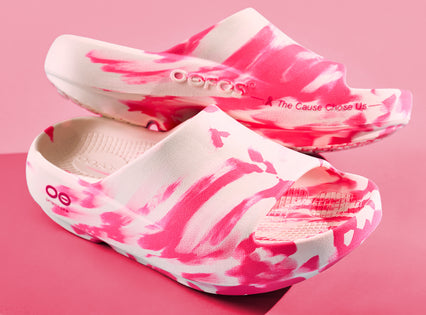Pink and white tie-dye sandals on a pink background