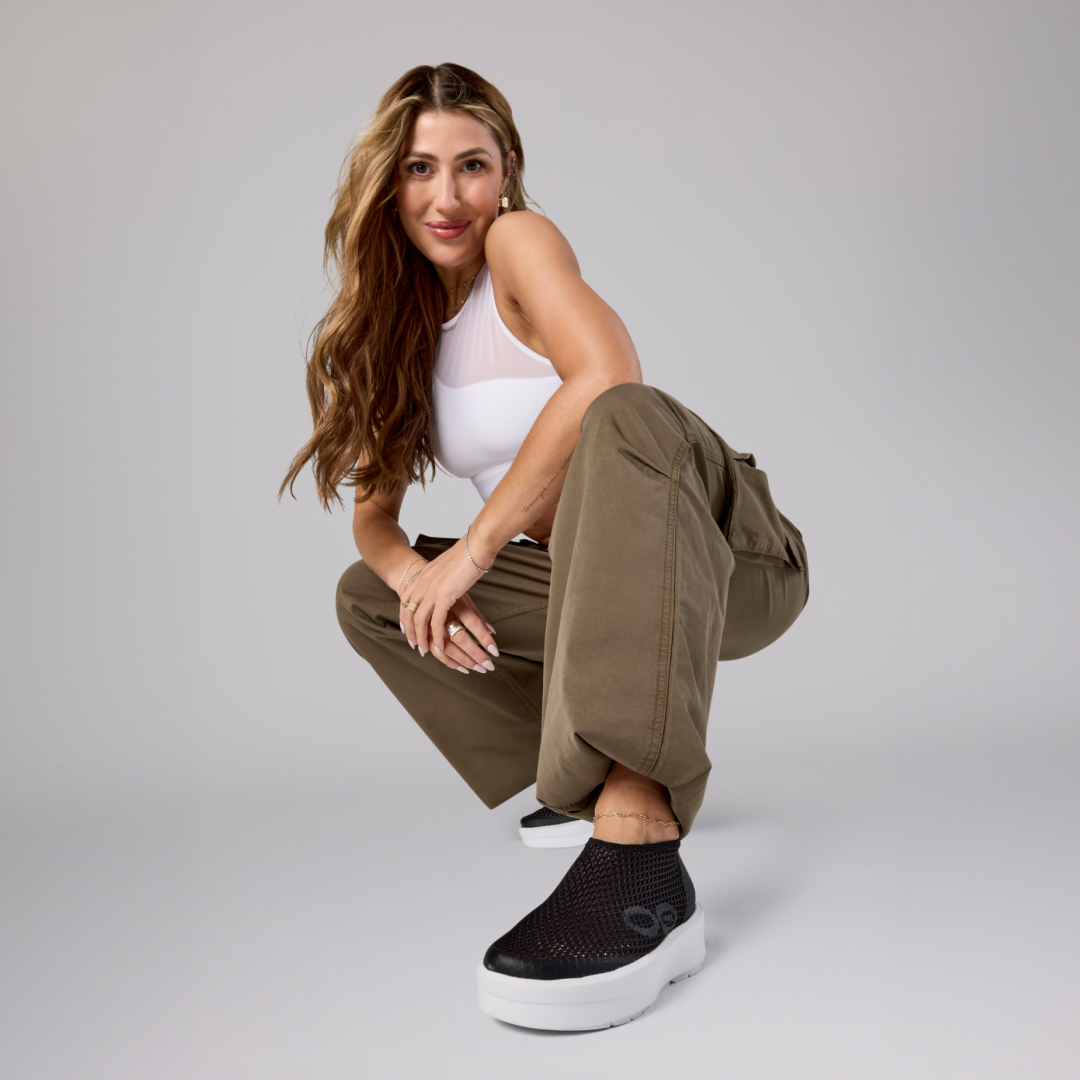 emma slater in studio wearing oomega chukka white black
