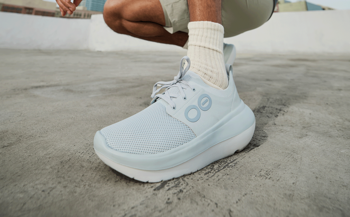 Men's OOmy Stride - Glacier close up of shoe on model outside | lifestyle