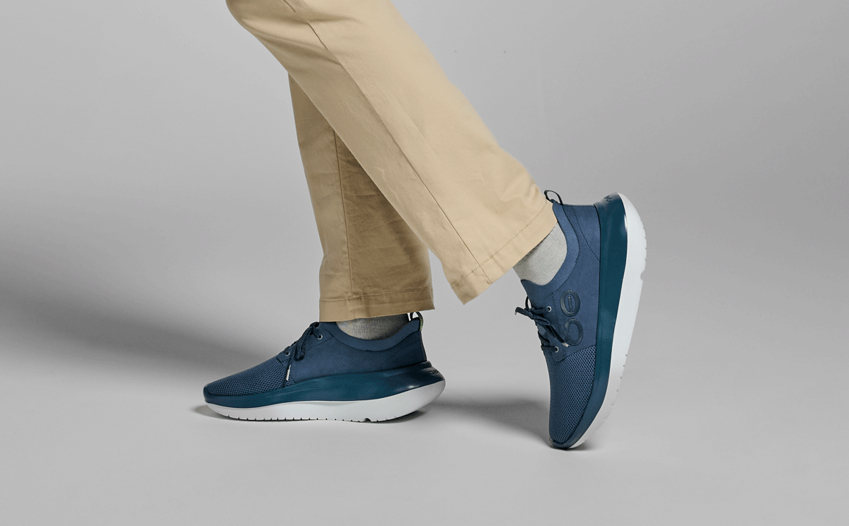 Men's OOmy Stride - Moroccan Blue side view of model standing in studio | lifestyle