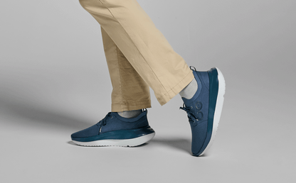 Men's OOmy Stride - Moroccan Blue side view of model standing in studio | lifestyle