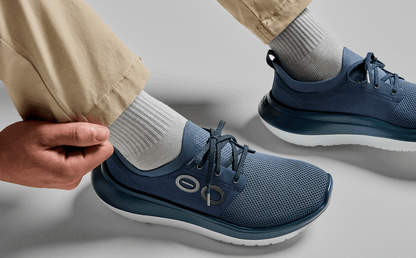 Men's OOmy Stride - Moroccan Blue model sitting down in studio | lifestyle