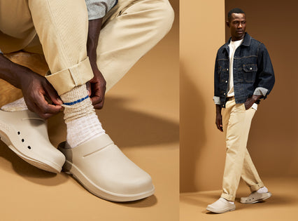 A split-panel fashion photo showing a person wearing off-white clog-style shoes with white socks and beige pants. The left panel is a close-up of the person tying the shoe, and the right panel shows the full person walking in a studio with a tan backdrop.