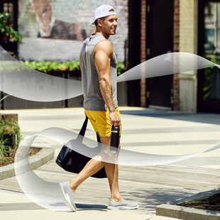 male model walking outside wearing oomg sport slate fade