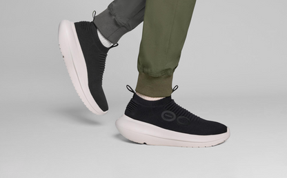 Men's OOmy Zen - Chalk Black model walking in studio | lifestyle
