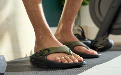 Men's OOriginal Sport Sandal - Tactical Green Lifestyle close up of model wearing shoe in gym | lifestyle