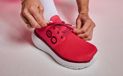 Women's OOmy Stride - Neon Berry close up of shoe on model in studio | lifestyle