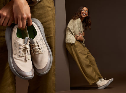 A split image showing a person holding a pair of beige and gray slip-on shoes on the left, and the same person wearing the shoes on the right against a dark brown studio background.