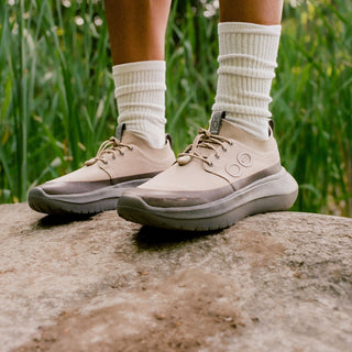 model standing on rock wearing roam ripstop nomad